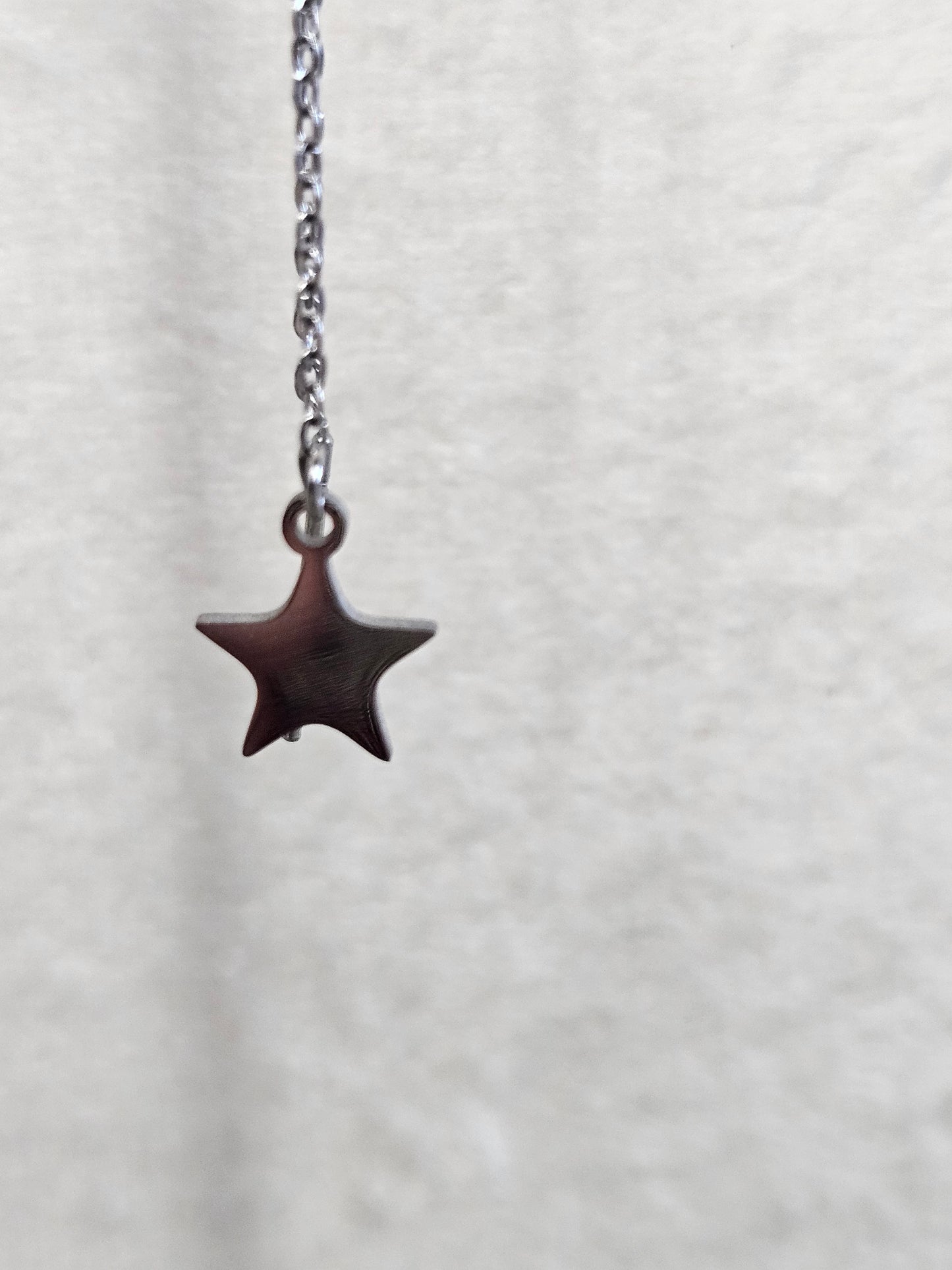 Boucles d'oreilles pendantes "Eclats d'étoile" argentée